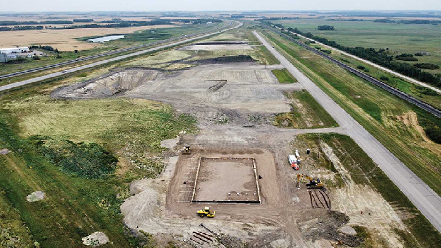 Four construction projects are under way in the RM of Moosomin commercial development just east of the town of Moosomin. From the foreground to the background, the four projects are the RM of Moosomin new shop, with the building footprint beginning to be visible (Lot 1), Johnson’s Grain – (Lot 2,3&4), Lot 5 is still for sale, Mantl (Lot 6), Sunny Transport (Lot 7), and lots 8 & 9 are still for sale.